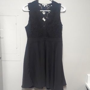 Black mini dress with a zip-up back